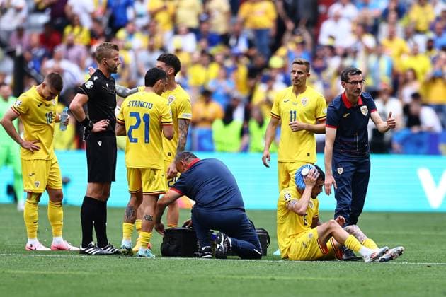 Marius Marin of Romania receives treatment Romania v Ukraine, UEFA European Championship, EM, Europameisterschaft 2024, Group E, Football, Munich Football Arena, Munich, Germany, 17 Jun 2024 EDITORIAL USE ONLY No use with unauthorised audio, video, data, fixture lists, club league logos or live services. Online in-match use limited to 120 images, no video emulation. No use in betting, games or single club league player publications. Copyright: xMichaelxZemanek Shutterstockx 14539636ab