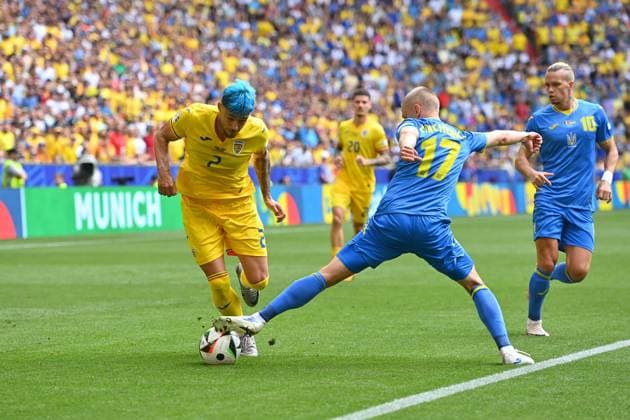 Andrei Ratiu ROM , action,duel against Oleksandr ZINCHENKO UKR ,re Mykhailo MUDRYK UKR , group stage group C Romania ROU Ukraine UKR on 17 06 2024 Football Arena Munich, Football UEFA EURO 2024 GERMANY from 14 06 2024 14 07 2024