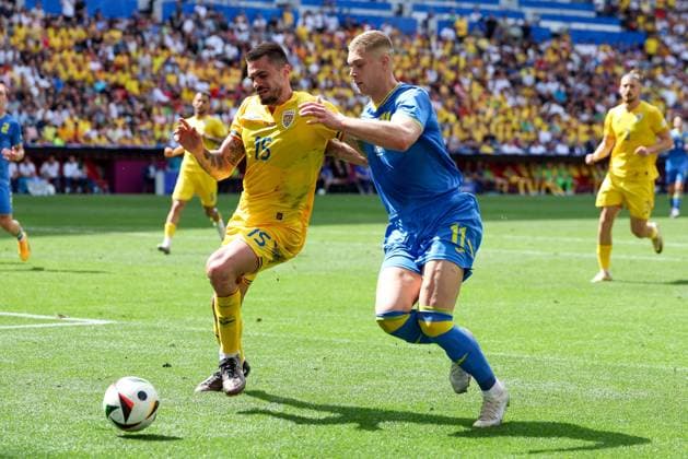 in duel, action, with Andrei Burca 15 Romaenien , Artem Dovbyk 11 Ukarine , Romania vs Ukraine Football, UEFA Euro 2024, Group stage, Matchday 1, 17 06 2024 Munich Bavaria Germany Copyright: xkolbert-press ChristianxKolbertx
