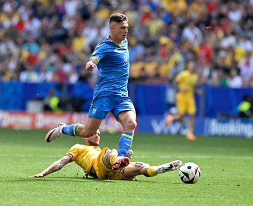 17 06 2024, Football UEFA EURO 2024, Preliminary Round, Match 10, Romania Ukraine, in the Football Arena Munich v l Georgiy Sudakov Ukraine v Darius Olaru Romania