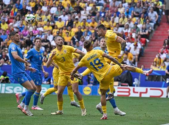 17 06 2024, Football UEFA EURO 2024, Preliminary round, Match 10, Romania Ukraine, at the Football Arena Munich Andrei Burca re, Romania defends the ball