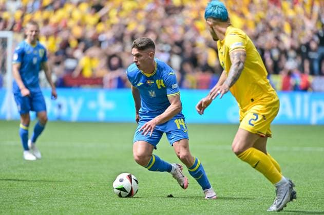 Picture shows Sudakov 14, Ukraine with ball on foot, Ratiu 2, Romania , 17 06 2024, Munich, Soccer, European Championship, Romania Ukraine, EVENT REGULATIONS PROHIBIT ANY USE OF PHOTOGRAPHS AS IMAGE SEQUENCES AND OR QUASI VIDEO xklx