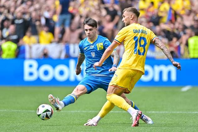 Picture shows Tsygankov 15, Ukraine , Dragus 19, Romania , 17 06 2024, Munich, Soccer, European Championship, Romania Ukraine, EVENT REGULATIONS PROHIBIT ANY USE OF PHOTOGRAPHS AS IMAGE SEQUENCES AND OR QUASI VIDEO xklx