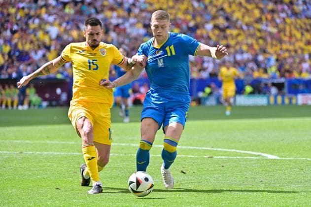 Picture shows from left to right duel Burca 15, Romania , Dovbyk 11, Ukraine , 17 06 2024, Munich, Soccer, European Championship, Romania Ukraine, EVENT REGULATIONS PROHIBIT ANY USE OF PHOTOGRAPHS AS IMAGE SEQUENCES AND OR QUASI VIDEO xklx