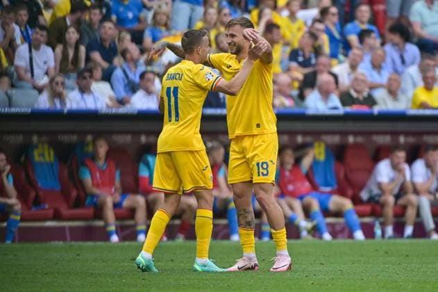 Picture shows goal celebration Romania, Bancu 11, Romania , Dragus 19, Romania , 17 06 2024, Munich, Soccer, European Championship, Romania Ukraine, EVENT REGULATIONS PROHIBIT ANY USE OF PHOTOGRAPHS AS IMAGE SEQUENCES AND OR QUASI VIDEO xklx