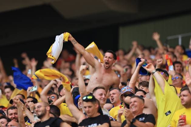 17th June 2024; Munich Football Arena, Munich, Germany; Euro 2024 Group E Football, Romania versus Ukraine; Romania s fans celebrate as Razvan Marin (rom) celebrates with team mates after he scored for 2-0 in the 53rd minute  ActionPlus12655812 PierrexTeyssot