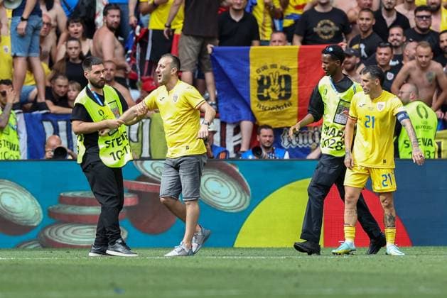 Soccer UEFA EURO 2024 group stage 1 matchday Romania Ukraine on 17 06 2024 at the Munich Football Arena in Munich Streaker is taken away by stewards xMSx
