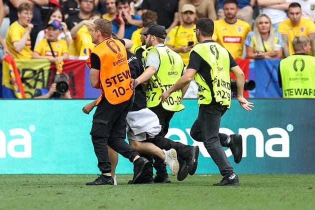 Soccer UEFA EURO 2024 group stage 1 matchday Romania Ukraine on 17 06 2024 at the Munich Football Arena in Munich Streaker is taken away by stewards xMSx