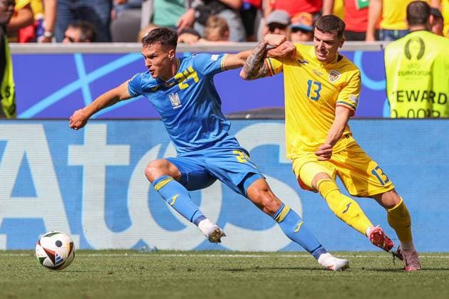 Soccer UEFA EURO 2024 Group Stage 1 Matchday Romania Ukraine on 17 06 2024 at the Munich Football Arena in Munich Oleksandr Tymchyk Ukraine , left Valentin Mihaila Romania , right xMSx