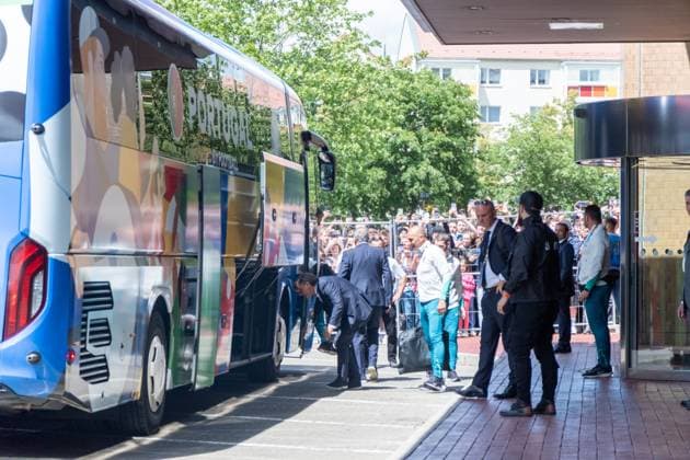 Arrival of Portugals national soccer team at the Westin Hotel before their preliminary round match against the Czech Republic in Leipzigs Central Stadium Around 250 people waited outside the hotel to catch a glimpse of the stars, but they didnt give the fans a second glance Arrival Portugal