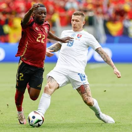 FRANKFURT, Arena Frankfurt, 17-06-2024 , European Football Championship Euro2024, Group stage match no.9 between Belgium and Slovakia. Belgium player Jeremy Doku and Slovakia player Juraj Kucka Belguim - Slovakia (Euro2024)  x25517697x Copyright: