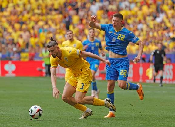 (240617) -- MUNICH, June 17, 2024 -- Mykola Matviyenko (R) of Ukraine competes against Radu Dragusin of Romania during the UEFA EURO, EM, Europameisterschaft,Fussball 2024 Group E match between Romania and Ukraine in Munich, Germany, on June 17, 2024. (Photo by Xinhua) (SP)GERMANY-MUNICH-FOOTBALL-EURO 2024-ROMANIA VS UKRAINE PhilippexRuiz 