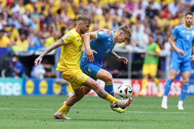 in duel, action, with Denis Dragus 19 Romaenien , Volodymyr Brazhko 18 Ukarine , Romania vs Ukraine Football, UEFA Euro 2024, Group stage, Matchday 1, 17 06 2024 Munich Bavaria Germany Copyright: xkolbert-press ChristianxKolbertx