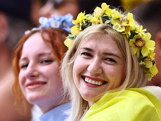 Fans of Ukraine smiling Romania v Ukraine, UEFA European Championship, EM, Europameisterschaft 2024, Group E, Football, Munich Football Arena, Munich, Germany, 17 Jun 2024 EDITORIAL USE ONLY No use with unauthorised audio, video, data, fixture lists, club league logos or live services. Online in-match use limited to 120 images, no video emulation. No use in betting, games or single club league player publications.  Copyright: xMichaelxZemanek Shutterstockx 14539636di