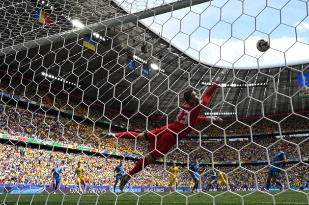 Nicolae Stanciu scores a goal for Andriy Lunin as RÄƒzvan Marin looks on during the UEFA EURO 2024 match between Romania and Ukraine at the Fussball Arena in Munich, Monday, June 17, 2024 Munich Copyright: xRazvanxPasarica SPORTxPICTURESx