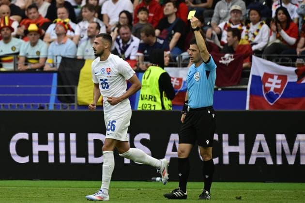 Slovakia s Ivan Schranz receives a yellow card from Referee Turkish Umut Meler during a soccer game between Belgian national soccer team Red Devils and Slovakia, Monday 17 June 2024 in Frankfurt Am Main, Germany, the first match in the group stage of the UEFA EURO, EM, Europameisterschaft,Fussball 2024 European championships. DIRKxWAEM  x94746583x