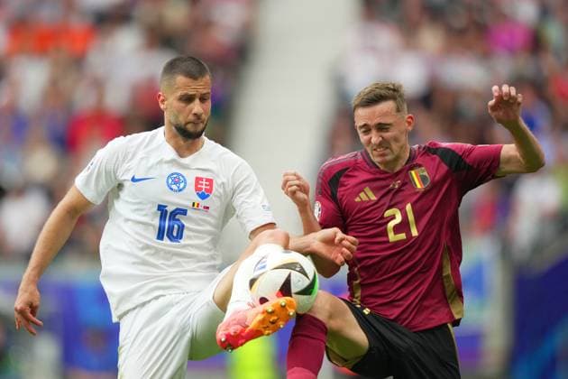 Slovakia s David Hancko fight for the ball with Belgium s Timothy Castagne during the Euro 2024 soccer match between Belgium and Slovakia at the Frankfurt Arena , Frankfurt , Germany - Monday 17 , June , 2024. - Soccer .  Copyright: xSpada LaPressex