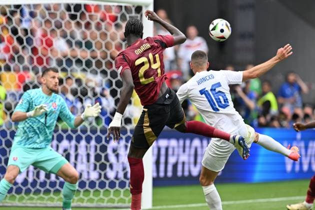 240617 EURO2024 BELGIUM VS SLOVAKIA Amadou Onana (24) of Belgium delivers an assist past David Hancko (16) of Slovakia during a soccer game between the national teams of Belgium, called the Red Devils and Slovakia on the first matchday in Group E in the group stage of the UEFA EURO, EM, Europameisterschaft,Fussball 2024 tournament , on Monday 17 June 2024 in Frankfurt , Germany . PHOTO SPORTPIX David Catry FRANKFURT GERMANY  Copyright: xx 463771
