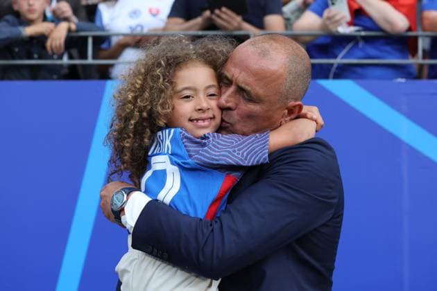 Coach Francesco Calzona Slovakia celebrates with his daughter after the big win, Emotion , Preliminary round match M09, BEL SVK, Group E, European Football Championship, Belgium vs Slovakia, European Football Championship, Belgium vs Slovakia, Frankfurt, 17 06 2024,
