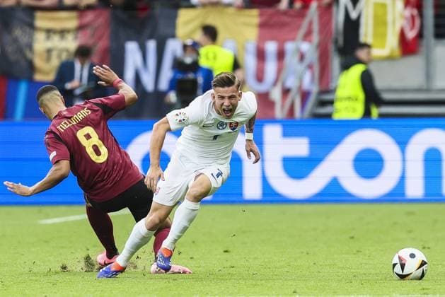 Belgium s Youri Tielemans and Slovakia s Tomas Suslov fight for the ball during a soccer game between Belgian national soccer team Red Devils and Slovakia, Monday 17 June 2024 in Frankfurt Am Main, Germany, the first match in the group stage of the UEFA EURO, EM, Europameisterschaft,Fussball 2024 European championships. BRUNOxFAHY  x94750079x