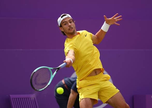 18th June 2024; Cinch Championships, Queens Club, West Kensington, London, England: Cinch Championships Queens Club, Day 2; Lorenzo MUSETTI (ITA) with a forehand shot to Alex DE MINAUR (AUS), mens singles match  ActionPlus12656203 JohnxPatrickxFletcher