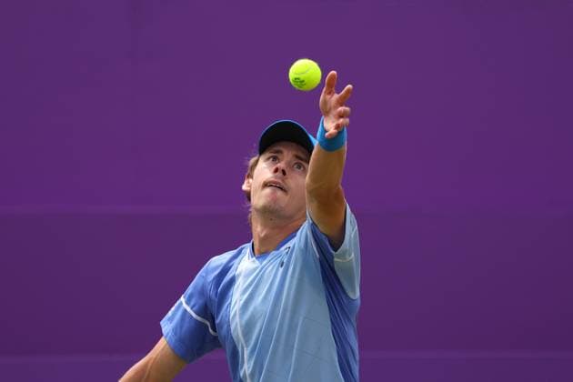 18th June 2024; Cinch Championships, Queens Club, West Kensington, London, England: Cinch Championships Queens Club, Day 2; Alex DE MINAUR (AUS) serves to Lorenzo MUSETTI (ITA), mens singles match  ActionPlus12656192 JohnxPatrickxFletcher