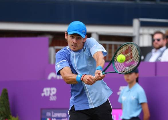 18th June 2024; Cinch Championships, Queens Club, West Kensington, London, England: Cinch Championships Queens Club, Day 2; Alex DE MINAUR (AUS) with a backhand shot to Lorenzo MUSETTI (ITA), mens singles match  ActionPlus12656197 JohnxPatrickxFletcher