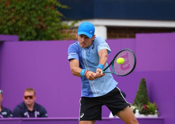 18th June 2024; Cinch Championships, Queens Club, West Kensington, London, England: Cinch Championships Queens Club, Day 2; Alex DE MINAUR (AUS) with a backhand shot to Lorenzo MUSETTI (ITA), mens singles match  ActionPlus12656198 JohnxPatrickxFletcher