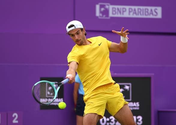 18th June 2024; Cinch Championships, Queens Club, West Kensington, London, England: Cinch Championships Queens Club, Day 2; Lorenzo MUSETTI (ITA) with a forehand shot to Alex DE MINAUR (AUS), mens singles match  ActionPlus12656199 JohnxPatrickxFletcher