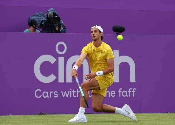 18th June 2024; Cinch Championships, Queens Club, West Kensington, London, England: Cinch Championships Queens Club, Day 2; Lorenzo MUSETTI (ITA) with a forehand shot to Alex DE MINAUR (AUS), mens singles match  ActionPlus12656200 JohnxPatrickxFletcher