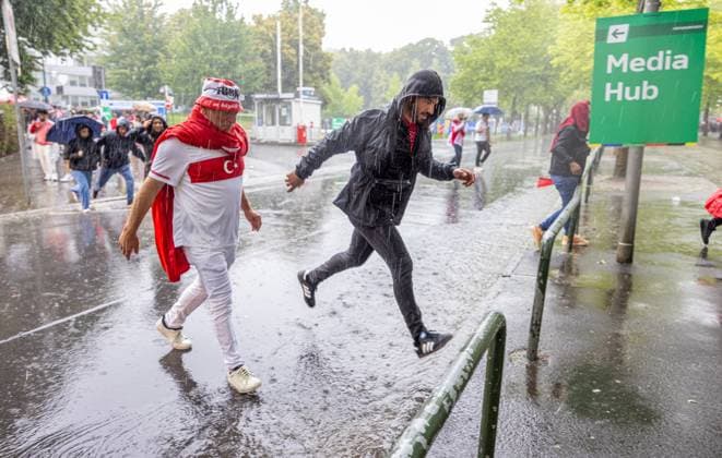 Football - UEFA EURO, EM, Europameisterschaft,Fussball 2024 - Group F - Turkey v Georgia DORTMUND, GERMANY - Tuesday, June 18, 2024: Supporters arrive in torrential rain during the UEFA Euro 2024 Group F match between Turkey and Georgia at the Westfalenstadion. (Photo by David Rawcliffe Propaganda) DORTMUND Westfalenstadion NORTH RHINE-WESTPHALIA GERMANY  Copyright: xDavidxRawcliffex P2024-06-18-Turkey_Georgia-2