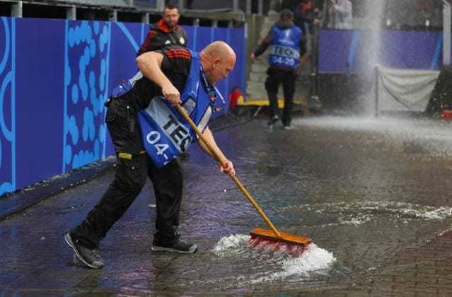 Groundstaff sweep away a flooded area after heavy rain Turkiye v Georgia, UEFA European Championship, EM, Europameisterschaft 2024, Group F, Football, BVB Stadion, Dortmund, Germany, 18 Jun 2024 EDITORIAL USE ONLY No use with unauthorised audio, video, data, fixture lists, club league logos or live services. Online in-match use limited to 120 images, no video emulation. No use in betting, games or single club league player publications. Copyright: xPaulxCurrie Shutterstockx 14543470ag