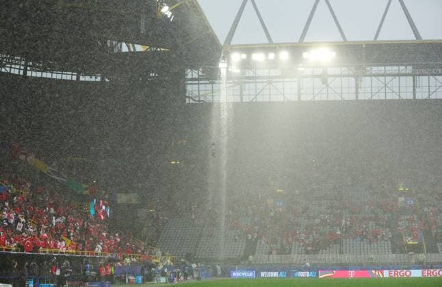 The stadium roof allows flooded water to burst through and soak fans and flood areas of the stadium Turkiye v Georgia, UEFA European Championship, EM, Europameisterschaft 2024, Group F, Football, BVB Stadion, Dortmund, Germany, 18 Jun 2024 EDITORIAL USE ONLY No use with unauthorised audio, video, data, fixture lists, club league logos or live services. Online in-match use limited to 120 images, no video emulation. No use in betting, games or single club league player publications. Copyright: xPaulxCurrie Shutterstockx 14543470az