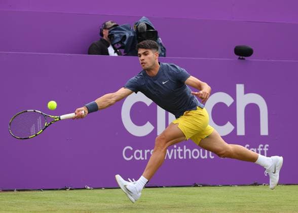 18th June 2024; Cinch Championships, Queens Club, West Kensington, London, England: Cinch Championships Queens Club, Day 2; Carlos Alcaraz (ESP) with a backhand shot to Francisco Cerundolo (ARG), mens singles match  ActionPlus12656357 JohnxPatrickxFletcher