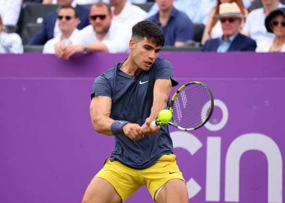 18th June 2024; Cinch Championships, Queens Club, West Kensington, London, England: Cinch Championships Queens Club, Day 2; Carlos Alcaraz (ESP) with a backhand shot to Francisco Cerundolo (ARG), mens singles match  ActionPlus12656354 JohnxPatrickxFletcher