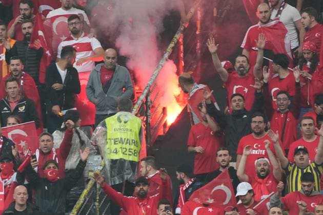 Turkish fans light Bengalos in the block and place them on the fence, where they cause a fire, stewards extinguish Dortmund 18 06 2024 Turkey vs Georgia, EURO2024 M11, Group F, EM Arena Dortmund