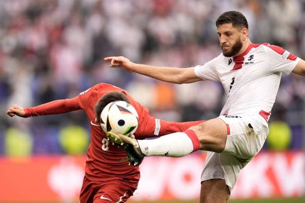 Turkey s Arda Guler and Georgia s Lasha Dvali during the Euro 2024 soccer match between Turkey and Georgia at the Signal Iduna Park, Dortmund, Germany - Tuesday 18, 2024. - Soccer.  Copyright: xFabioxFerrari LaPressex