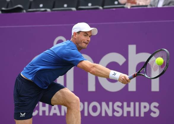 18th June 2024; Cinch Championships, Queens Club, West Kensington, London, England: Cinch Championships Queens Club, Day 2; Spectators waving the flag of Scotland for Andy Murray (GBR) with a backhand shot to Alexei Papyrin (AUS), mens singles match  ActionPlus12656466 JohnxPatrickxFletcher
