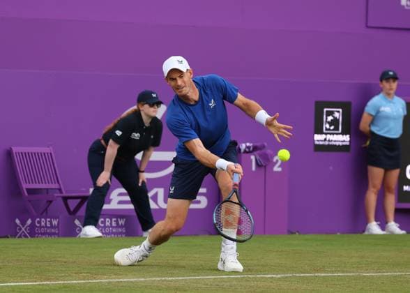 18th June 2024; Cinch Championships, Queens Club, West Kensington, London, England: Cinch Championships Queens Club, Day 2; Spectators waving the flag of Scotland for Andy Murray (GBR) with a forehand shot to Alexei Papyrin (AUS), mens singles match  ActionPlus12656455 JohnxPatrickxFletcher