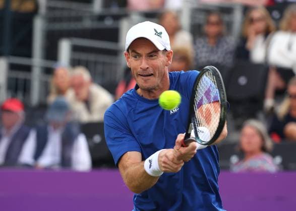 18th June 2024; Cinch Championships, Queens Club, West Kensington, London, England: Cinch Championships Queens Club, Day 2; Spectators waving the flag of Scotland for Andy Murray (GBR) with a backhand shot to Alexei Papyrin (AUS), mens singles match  ActionPlus12656456 JohnxPatrickxFletcher