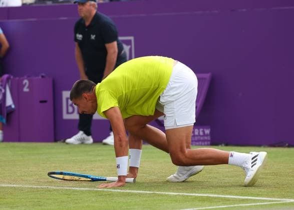 18th June 2024; Cinch Championships, Queens Club, West Kensington, London, England: Cinch Championships Queens Club, Day 2; Alexei Papyrin (AUS) slips onto court Andy Murray (GBR), mens singles match  ActionPlus12656479 JohnxPatrickxFletcher