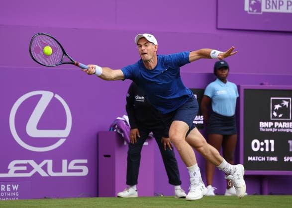 18th June 2024; Cinch Championships, Queens Club, West Kensington, London, England: Cinch Championships Queens Club, Day 2; Spectators waving the flag of Scotland for Andy Murray (GBR) with a forehand shot to Alexei Papyrin (AUS), mens singles match  ActionPlus12656462 JohnxPatrickxFletcher