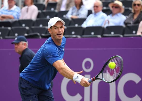 18th June 2024; Cinch Championships, Queens Club, West Kensington, London, England: Cinch Championships Queens Club, Day 2; Spectators waving the flag of Scotland for Andy Murray (GBR) with a backhand shot to Alexei Papyrin (AUS), mens singles match  ActionPlus12656464 JohnxPatrickxFletcher