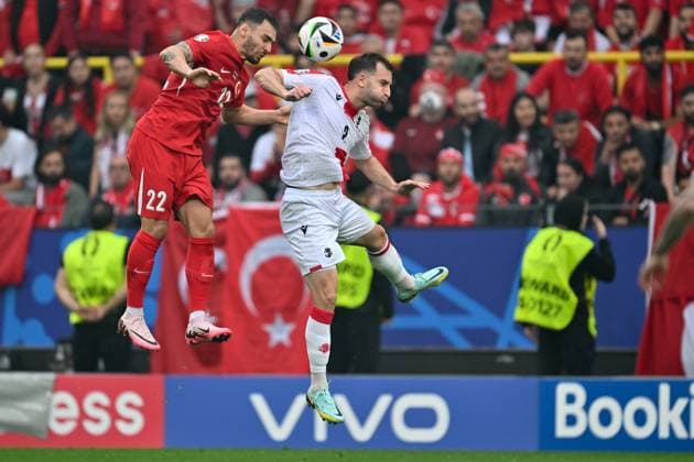 240618 EURO2024 TURKEY VS GEORGIA Kaan Ayhan (22) of Turkey fighting for the ball with Otar Kakabadze (2) of Georgia during a soccer game between the national teams of Turkey and Georgia on the first matchday in Group F in the group stage of the UEFA EURO, EM, Europameisterschaft,Fussball 2024 tournament , on Tuesday 18 June 2024 in Dortmund , Germany . PHOTO SPORTPIX David Catry DORTMUND GERMANY  Copyright: xx 464527