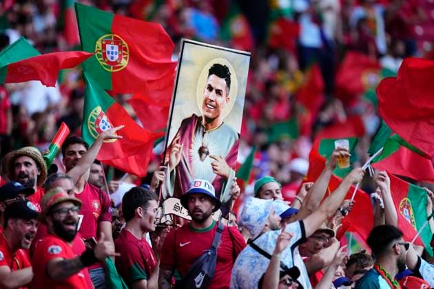 Portugal v Czechia: Group F - UEFA EURO, EM, Europameisterschaft,Fussball 2024 Portugal supporter with Cristiano Ronaldo picture during the UEFA EURO 2024 group stage match between Portugal and Czechia at Football Stadium Leipzig on June 18, 2024 in Leipzig, Germany. Leipzig Germany  Copyright: xJosexBretonx originalFilename:breton-portugal240618_npZwe.jpg