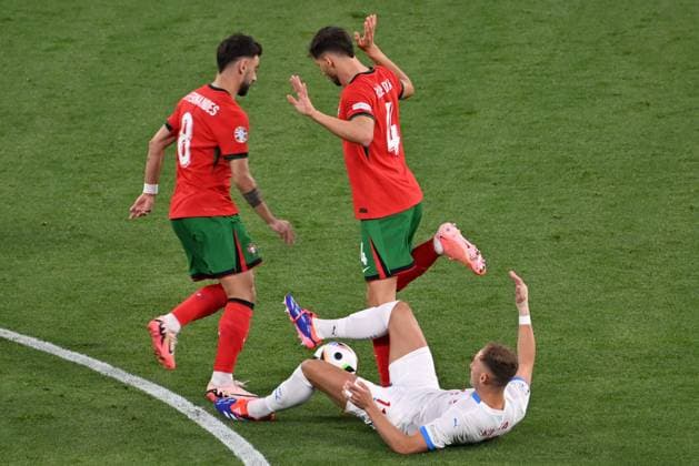 From left Ruben Dias of Portugal, Czech Jan Kuchta, Bruno Fernandes of Portugal in action during the Czech Republic vs. Portugal match within the European Football Championships, Leipzig, Germany, June 18, 2024. (CTKxPhoto OndrejxHajek) CTKPhotoP2024061808615  CTKPhotoP2024061808615
