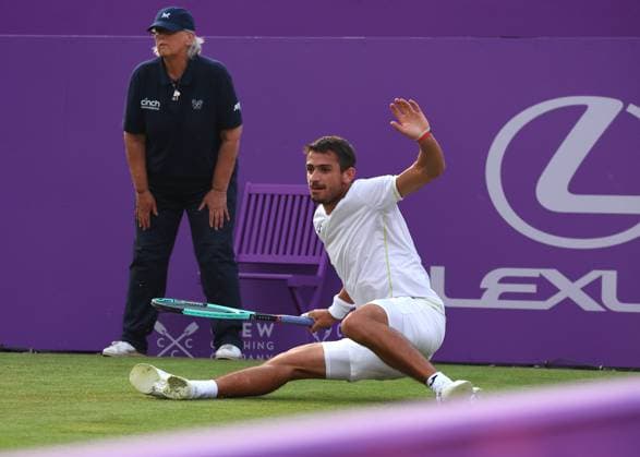 18th June 2024; Cinch Championships, Queens Club, West Kensington, London, England: Cinch Championships Queens Club, Day 2; Mariano Navone (ARG) slips and falls onto the court in his mens singles match against Jack Draper (GBR)  ActionPlus12656658 JohnxPatrickxFletcher