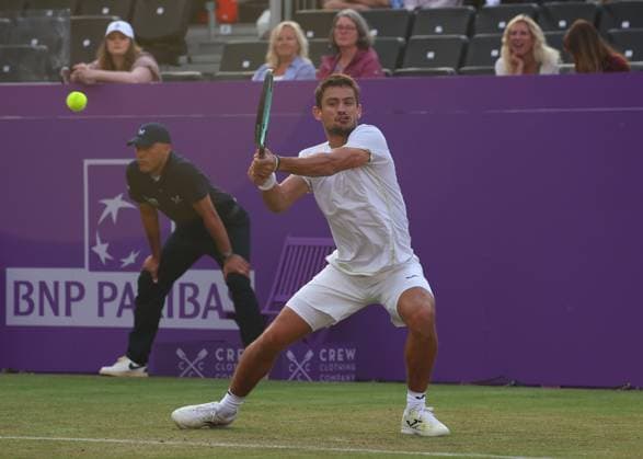 18th June 2024; Cinch Championships, Queens Club, West Kensington, London, England: Cinch Championships Queens Club, Day 2; Mariano Navone (ARG) with a backhand shot to Jack Draper (GBR), mens singles match  ActionPlus12656659 JohnxPatrickxFletcher