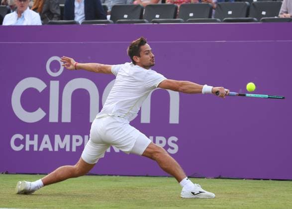 18th June 2024; Cinch Championships, Queens Club, West Kensington, London, England: Cinch Championships Queens Club, Day 2; Mariano Navone (ARG) with a backhand shot to Jack Draper (GBR), mens singles match  ActionPlus12656664 JohnxPatrickxFletcher