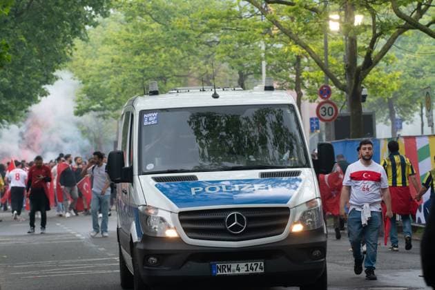 Turkish Football Fans March Toward BVB Stadium Dortmund Before The Game Between Turiye An Georgia A police car is observing the situation as thousands of Turkish football fans are marching toward BVB stadium of Dortmund before the group F game between Turkey and Georgia in Dortmund, Germany, on June 16, 2024. Dortmund Germany  Copyright: xYingxTangx originalFilename:tang-notitle240618_npshz.jpg